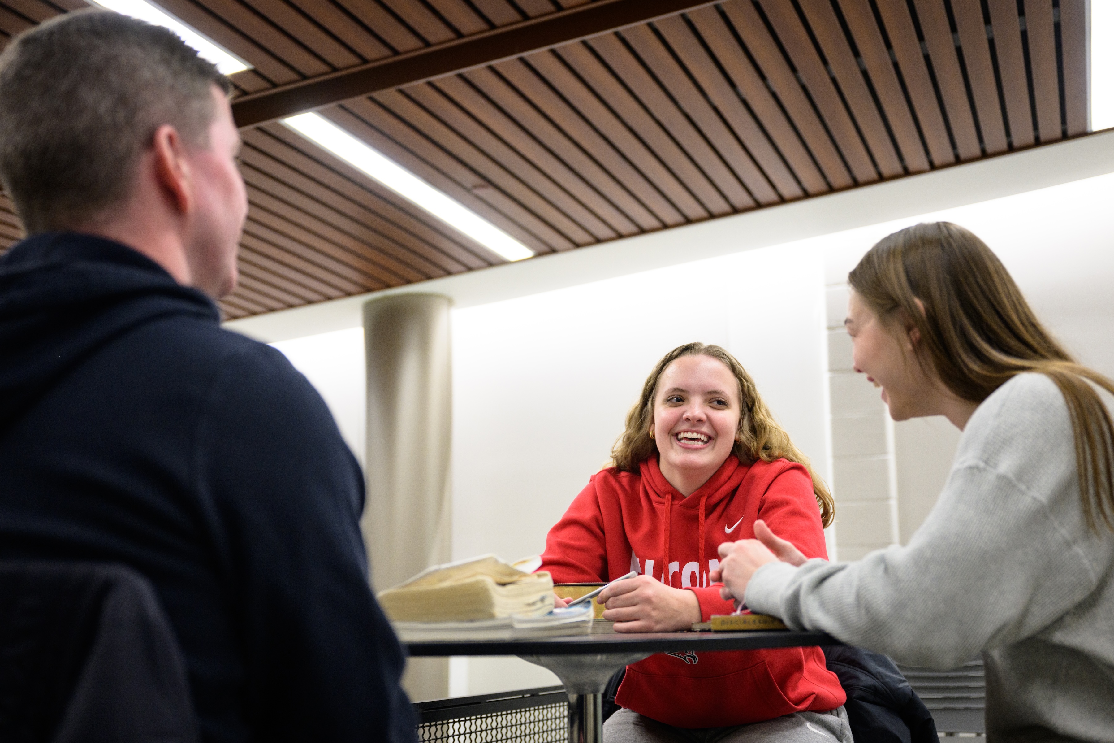 two student athletes meeting with Jason