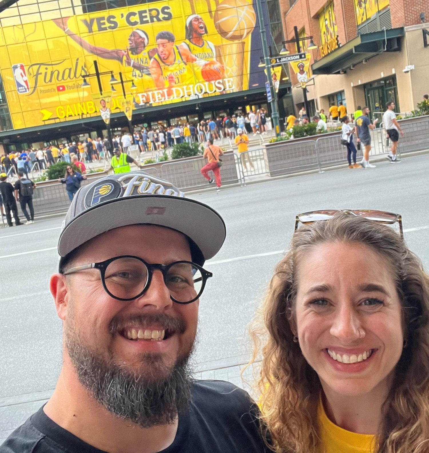Andrew & Steph smiling while at a sports event