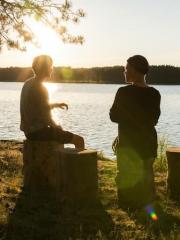 Alumni looking out over a lake