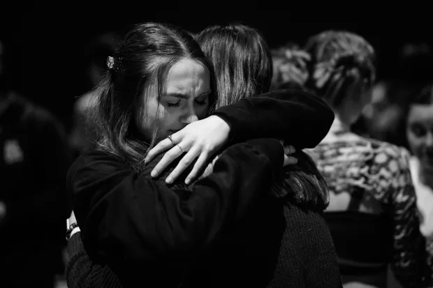 emotional embrace between friends