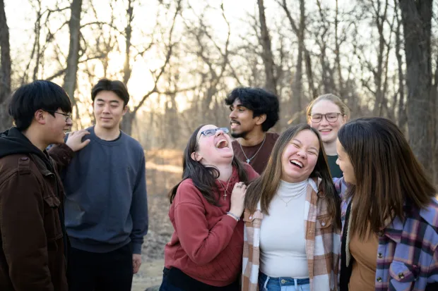small group of students hanging out and laughing