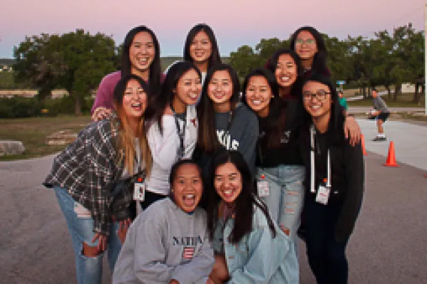 a group of Asian American students smiling at the camera