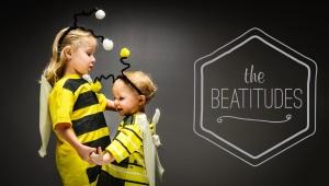 two small children dressed as bumblebees, and a graphic reading "The Beatitudes"