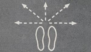 Chalk outline of footsteps with five arrows pointing outward in all directions