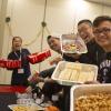 Students at Native IV conference smiling and holding food 