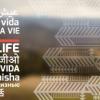 Live Life written in different languages on blurred landscape background
