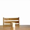 a chair and table with one coffee mug resting on  it