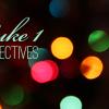 Blurred Christmas lights with words "Luke 1 Perspectives"